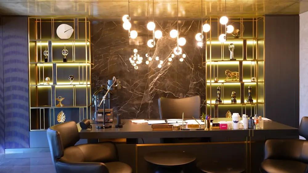 An executive office with marble walls.